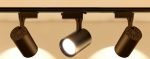 Black magnetic track lights installed on ceiling rail